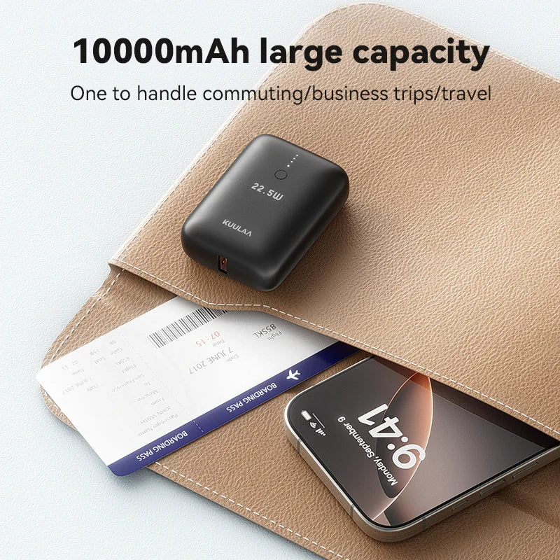 Power bank with 10000mAh capacity on a surface with a phone and ticket