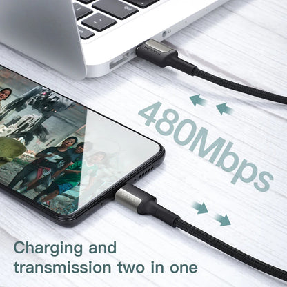 Phone and laptop connected by a cable with '480Mbps' text on a white surface.