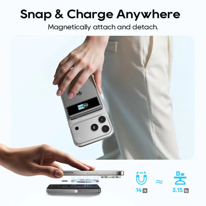 Smartphone with a magnetic attachment feature being used by hands on a light gray background.