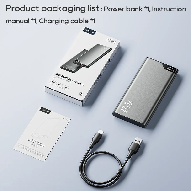 Power bank with packaging, manual, and charging cable on a light gray background