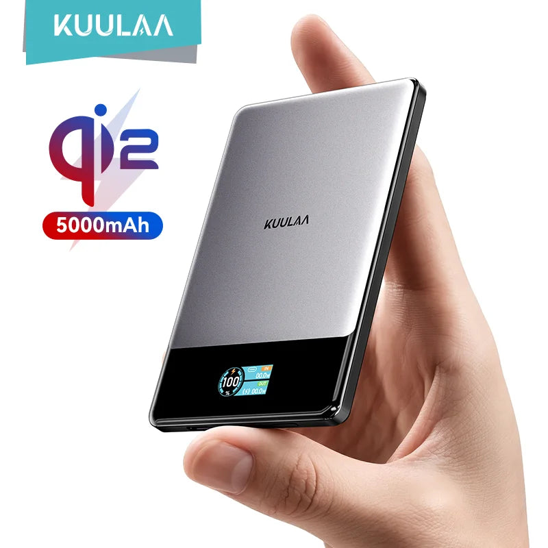 KUULAA power bank held in a hand with QI2 and 5000mAh indicators.