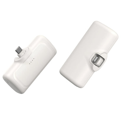 Two white power banks with charging ports on a white background