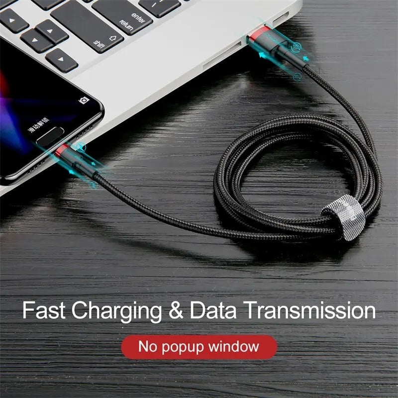 Cable connecting a laptop and smartphone on a dark surface with text about fast charging and data transmission.