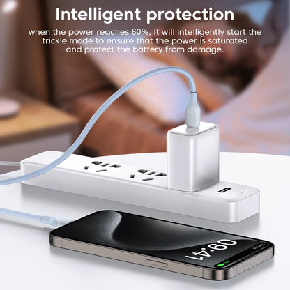 White power strip with multiple outlets and USB ports, connected to a smartphone, on a blurred background.